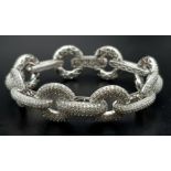 A Head-Turning 18K White Gold 12ct Diamond Circle Bracelet. 1200 VVS/VS quality encrusted diamonds