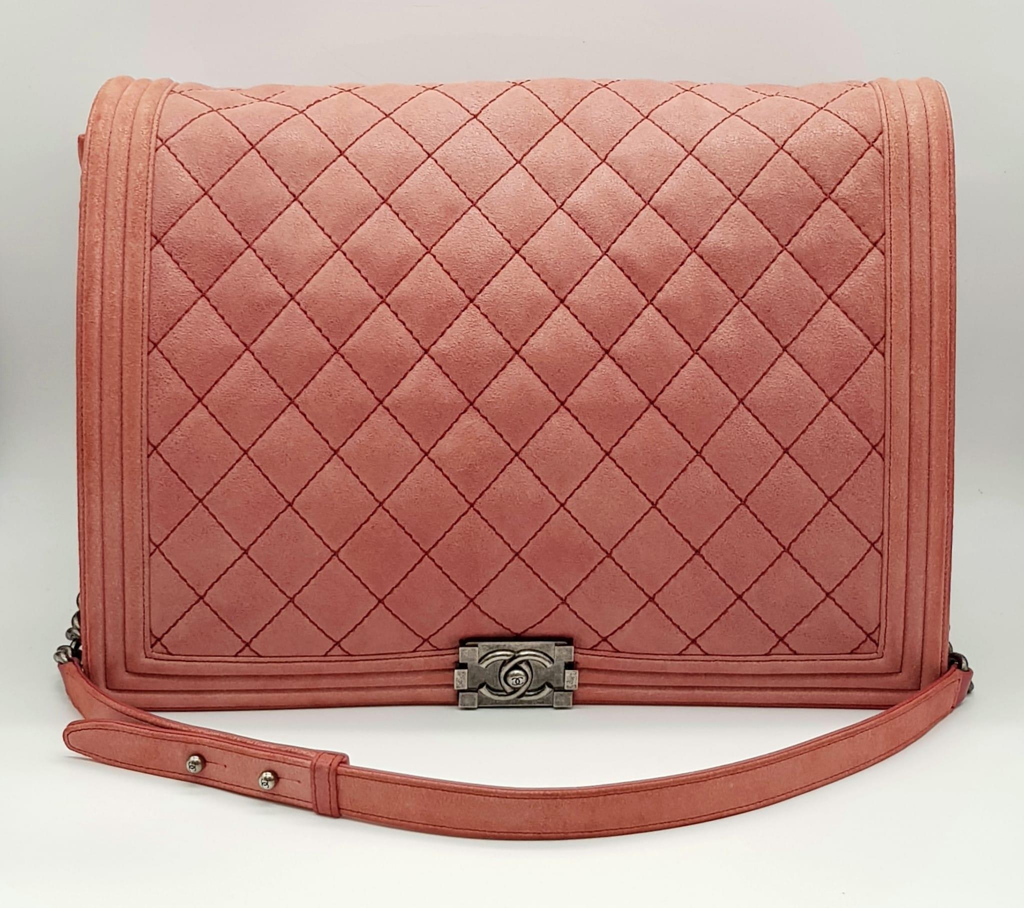 A Chanel Maxi Boy Shoulder Bag. Pink quilted suede flap on leather. Heavy brushed steel finish on