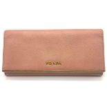 A Prada Patent Pink Leather Wallet. Gilded trim and logo. 19cm wide by 9cm height. Please see photos