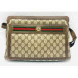 A Gucci Ophidia Small Shoulder Bag. Gucci monogram coated canvas with leather handles and trim.