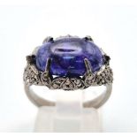An Art Deco Style 7.30ct Tanzanite Gemstone Ring with 0.65ct Diamond Accents. Set in 925 Silver.