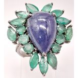 A 13ct Tanzanite Cabochon Gemstone Ring with 8ct of Emerald Leaves and 0.30ct of Diamond Accents