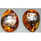 Two large resin amber pendants with a butterfly inclusion. App 6 cm long.