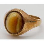 A Vintage 9K Rose Gold Tigers Eye Gents Ring. A lovely banded Tigers Eye cabochon. Size W. 6.31g
