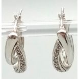 A Fashionable Pair of 9K White Gold and Diamond Double-Hoop Earrings. 2.62g total weight.