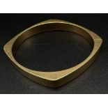 A Hans Hansen 14k Yellow Gold Bangle. Lovely piece from this Danish designer. Clip opening. 24.9g.