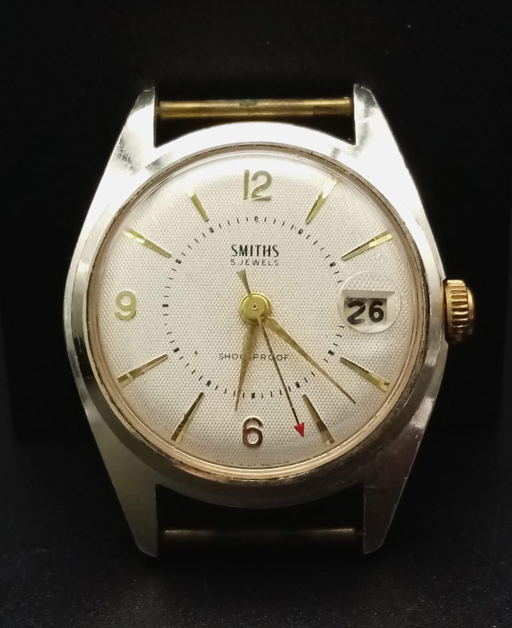 A Vintage Smiths 5 Jewels Watch Case - 34mm. White dial with date window. Mechanical movement in