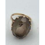 9 carat GOLD RING having extremely large cushion cut Brown AMETHYST set to top in a 12 claw mount.