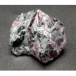 103.54 Ct Hessonite Garnet. Purplish Red in Rough Shape. Comes with IGL&I Certificate.