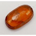 A 6.90ct Faceted Natural Hessonite Garnet, in an Oval Shape cut. Come with the GLI Certificate.