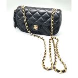 A Givenchy Black Quilted Leather Flap Handbag. Gold-tone hardware. Zipped interior pocket. Please