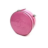 A Chanel Round as Earth Patent Pink Leather Bag. Zipped closure. One interior pocket. Shoulder strap