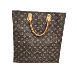 A Louis Vuitton Monogram Canvas Tote Bag. 36cm width. 38cm height. Inner open compartments. Brown
