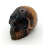 A Hand-Carved Tigers Eye Skull Figure. Ornament or paperweight. 6cm