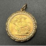 A 22K Gold 1957 Full Sovereign Coin set in a 9k Gold Pendant. 10.75g total weight.