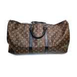 A Louis Vuitton Keepall Hand-Luggage Bag. Brown monogram canvas with black leather handles and trim.