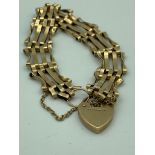 Vintage 9 carat GOLD GATE BRACELET Complete with gold heart padlock and gold safety chain. 9.2