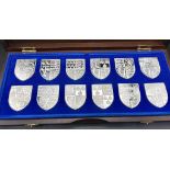 A Danbury Mint Royal Arms - Limited Edition Collectors Set of 12 Proof Sterling Silver Ingots.