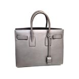 An Elegant Saint Laurent Sac de Jour Grey Leather Handbag. Luxurious soft grey leather. Multiple