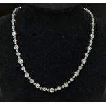 An Elegant 18K White Gold Diamond Necklace. Over 11.5ct of quality diamonds create the perfect piece