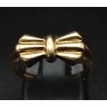 A 9K Yellow Gold Bow Tie Ring. Size K. 2.25g