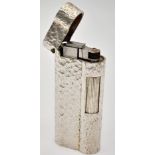 A Vintage Dunhill Silver-Plated Lighter. Bark-effect decoration. In good condition but needs some