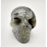 A Menacing Grabbo Jasper Skull Figure. 5 x 4cm.