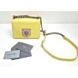 A Christian Dior Diorama Lemon Yellow Flap Bag. Calf-skin leather with silver-tone hardware.