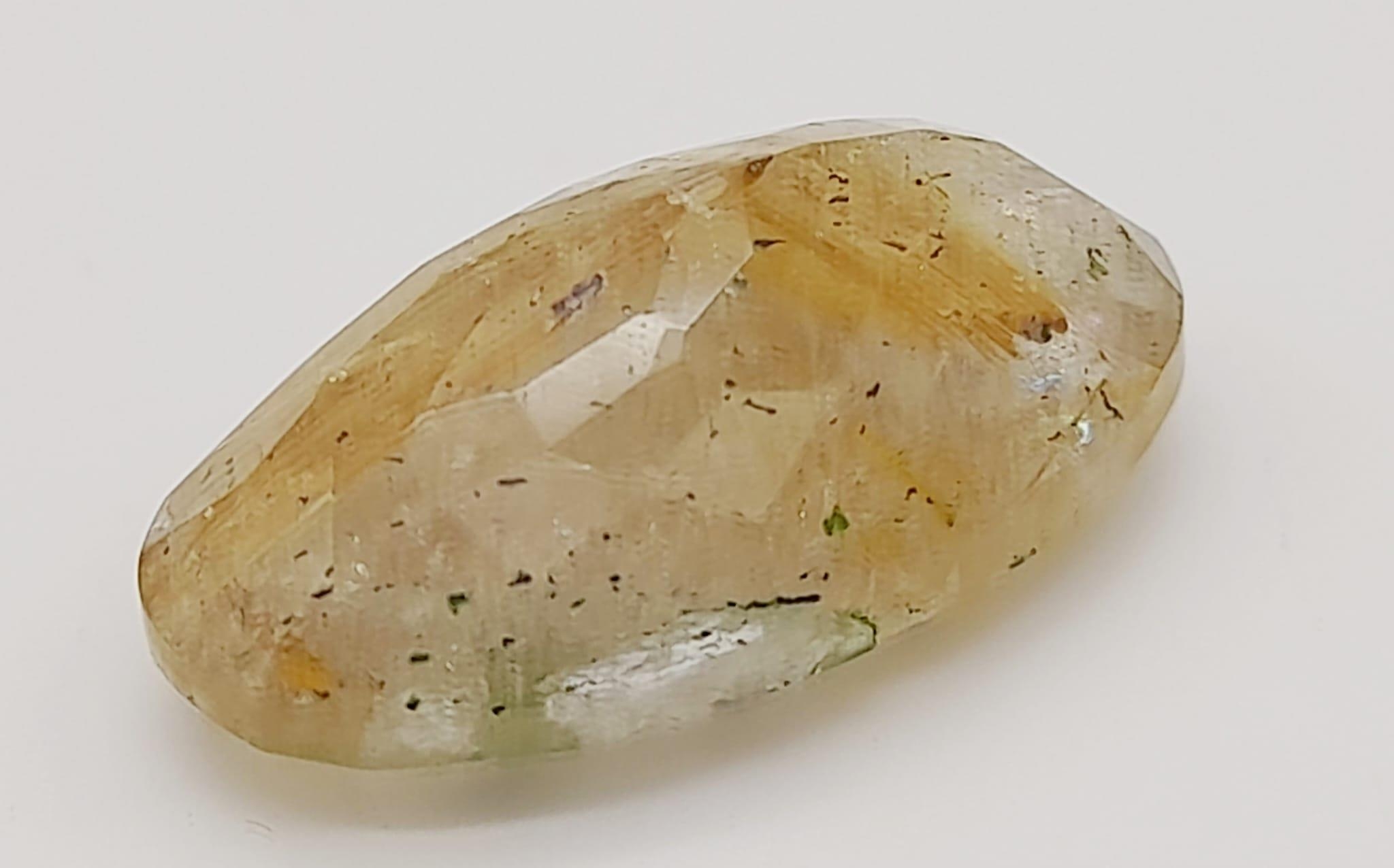 A 13.10ct Natural Rutile Quartz, in an Oval Shape cut. Come with the GLI Certificate - Image 4 of 8