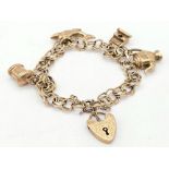 A 9k Yellow Gold Charm Bracelet With Heart Clasp. Only four charms but one of them is a Dolphin!