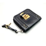 A Chloe Paddington Clutch Purse/Wallet. Gold-tone padlock with key. Zipped and clip closures. Dust