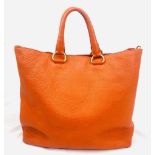 A Prada Burnt Orange Tote Bag. Soft leather with gilded hardware. Inner zipped and flap