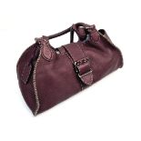 A Fendi Purple Leather Handbag with Dust Cover. Silver tone hardware. Interior zipped compartment.