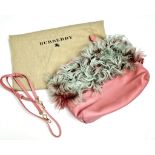 A Burberry Prorsum Crossbody Pink Leather Bag. Gold-tone hardware. Fur trim. Adjustable shoulder