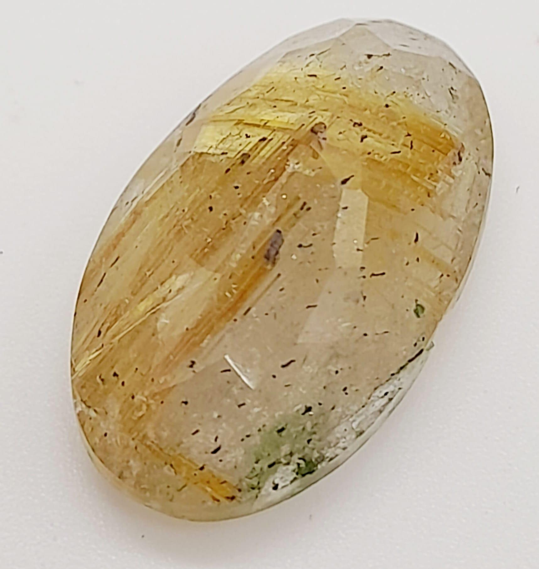 A 13.10ct Natural Rutile Quartz, in an Oval Shape cut. Come with the GLI Certificate - Image 2 of 8