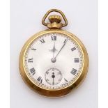 An Antique Smiths Pocket Watch. Yellow metal - top winder. White dial with second sub dial. In