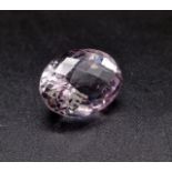 A 15.52ct oval mixed cut Rose Quartz. IDT certified.