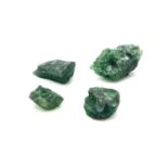 A 10.30ct Diopside. 4 Roughs. Comes with a certificate.
