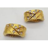 A spectacular 22 K yellow gold clip earrings with diamonds, by the renowned Greek designer