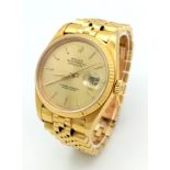 AN 18K GOLD ROLEX OYSTER PERPETUAL DATEJUST WITH SOLID GOLD STRAP AND GOLDTONE DIAL . 36mm