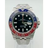 A Rolex GMT - Master II Pepsi Gents Watch. Stainless steel strap and case - 40mm. Ceramic Pepsi-