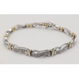 A 14 K yellow and white gold bracelet with diamonds (1.10 carats).Length: 18 cm, weight: 13.1 g.