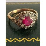 Vintage 9 carat GOLD RUBY RING having cushion cut RUBY mounted to top with Aqua gemstone surround.