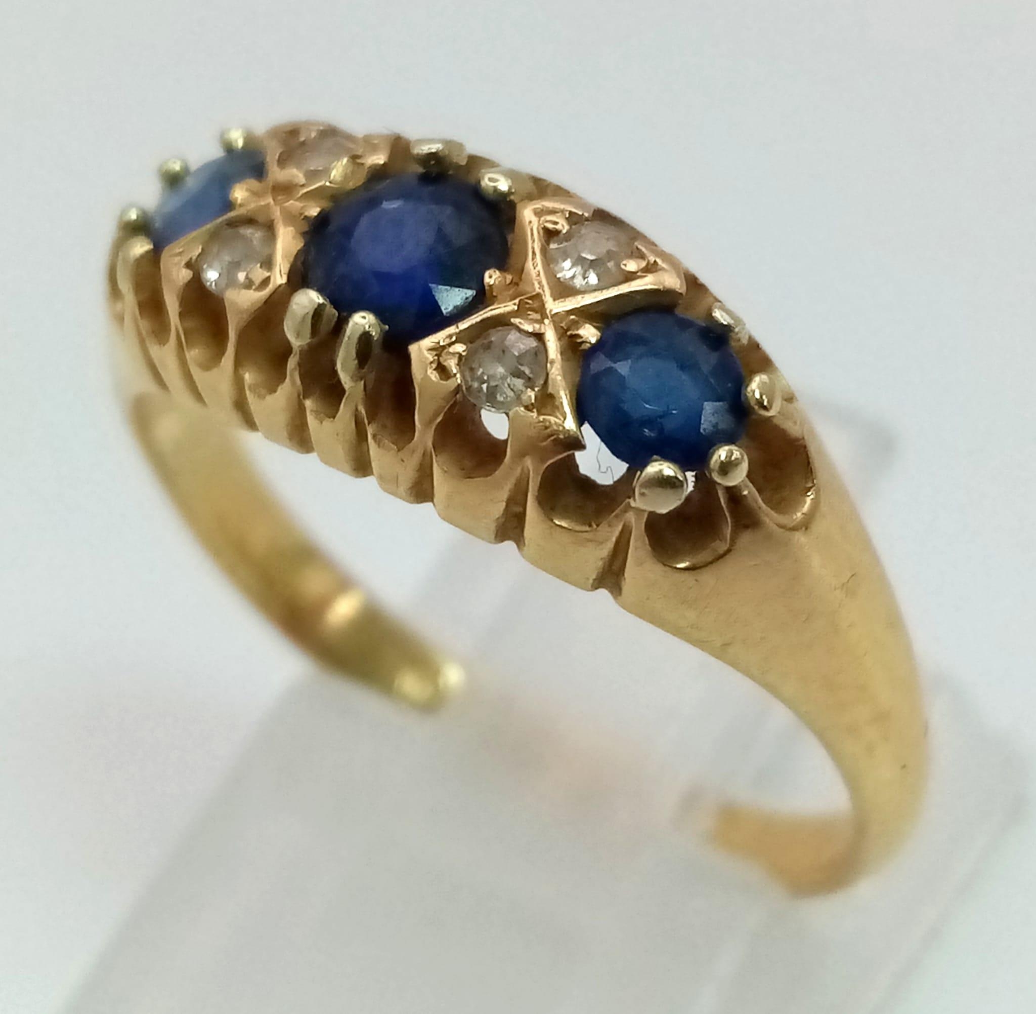 An antique, 18 K yellow gold ring with old cut diamonds and sapphires (0.65 carats). Hallmarked - Image 2 of 4