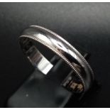 An 18K White Gold Band Ring. Inscription on inner. Size T. 3.57g