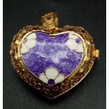 A beautifully made, 18 k yellow gold and enamel heart shaped locket. Dimensions: 30 x 25 x 16 mm (