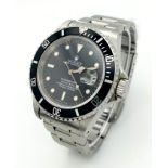 A ROLEX SUBMARINER - THE ULTIMATE DIVERS WATCH IN STAINLESS STEEL WITH BLACK DIAL AND BEZEL . 40mm A
