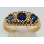 An antique, 18 K yellow gold ring with old cut diamonds and sapphires (0.65 carats). Hallmarked