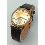 A Rare Vintage Circa 1950 Rolex Precision Gold Gents Watch. Brown leather strap. 9K Gold Dennison