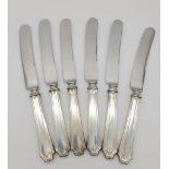 A SET OF 6 1920'S SILVER HANDLED KNIVES , 22cms IN LENGTH 358.2gms
